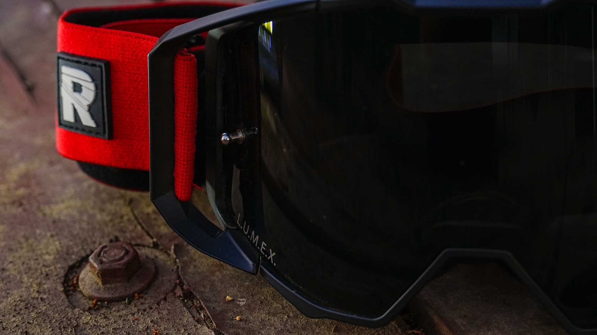 red and black motocross goggles