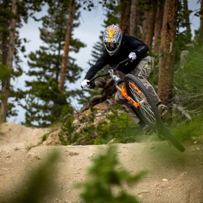 Mountain biker riding a trail, Beyond the goggles dive into the world of RKT Optics.